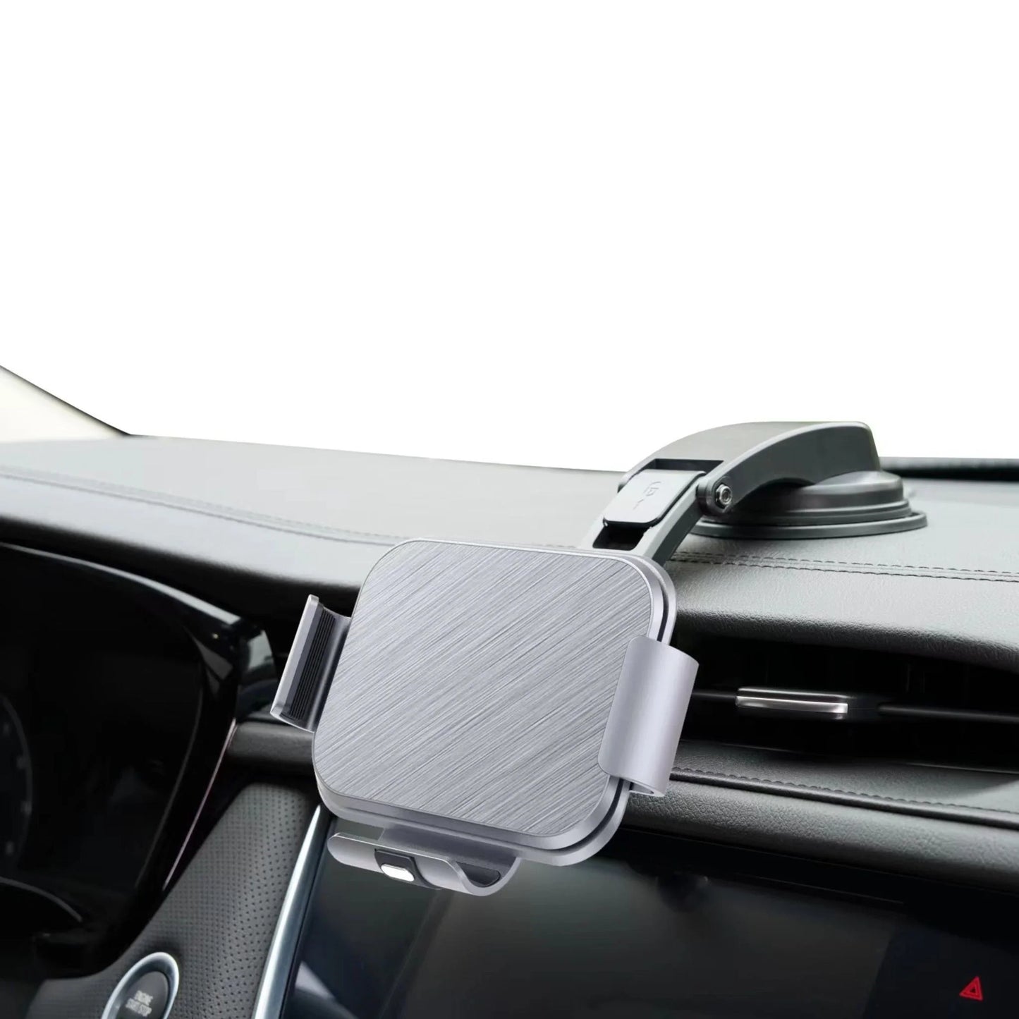 Silver car dashboard phone holder mount with suction cup attached to dashboard