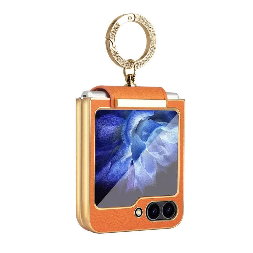Orange leather protective case with gold accents and rhinestone keychain for foldable smartphone