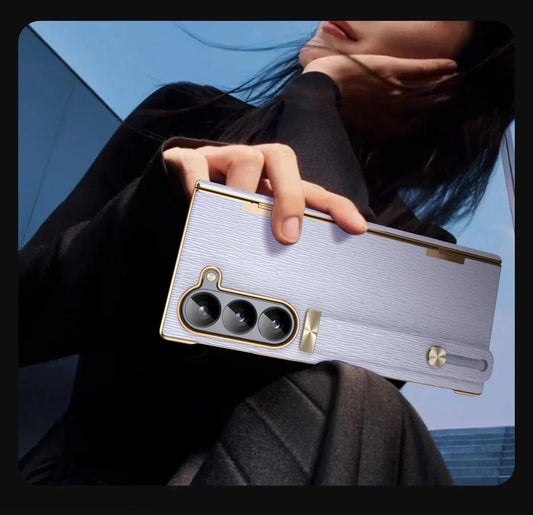 Close-up of a person holding a phone with a triple-lens camera and textured light purple case