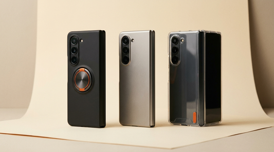 A row of three premium Galaxy Z Fold cases — ring-stand, slim titanium and clear — on cream paper, the best Z Fold 7 cases tested for 2026