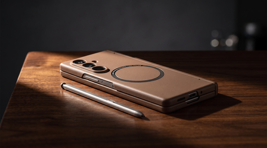 FoldifyCase Kinetic P1 magnetic case on a dark walnut desk next to a precision metal stylus pen — editorial hero for which Galaxy Z Fold cases hold the S-Pen