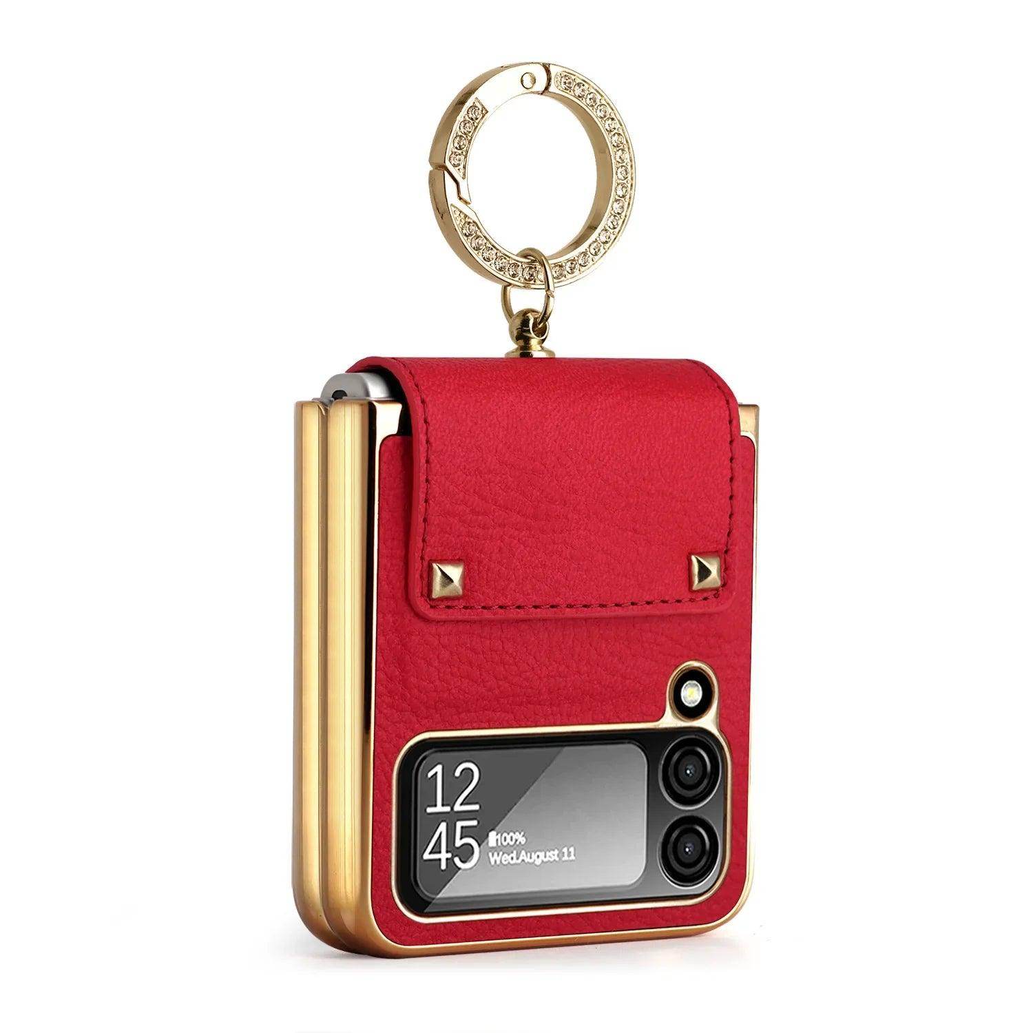 Red leather foldable smartphone case with gold accents and crystal-embellished keyring