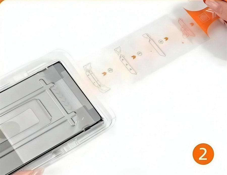 Pulling the orange release tab out of the tray in one slow motion